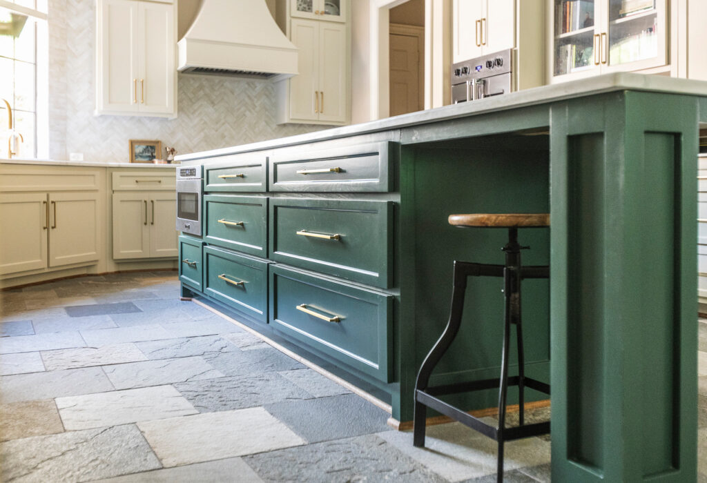 Green kitchen cabinets with white countertops and modern kitchen renovation design